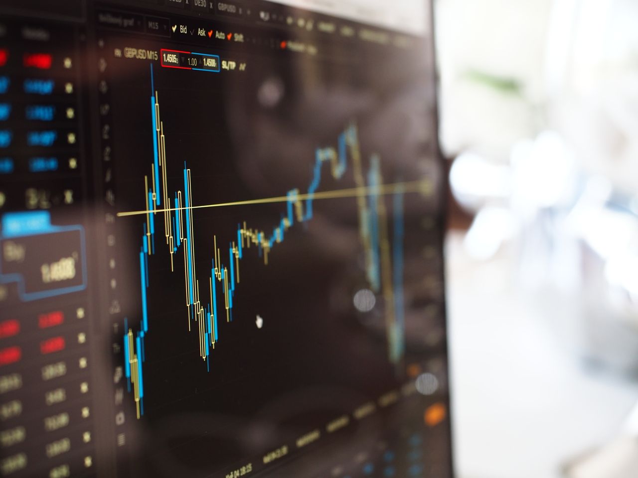 A stock market display board showing rising and falling prices, representing how the market works