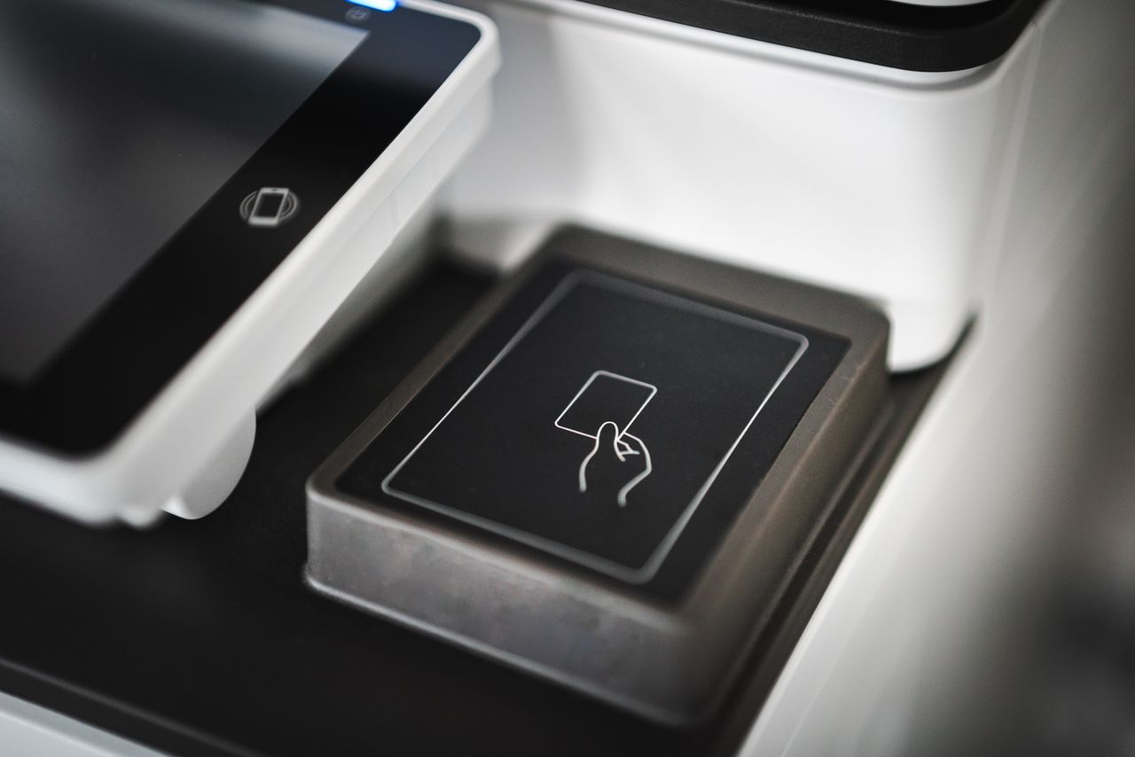 Contactless card reader at checkout, the everyday moment a first credit card is made for