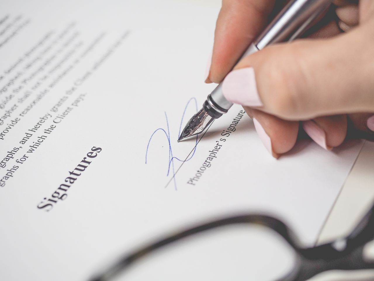 Pen poised over paperwork, the review pass that catches tax filing mistakes