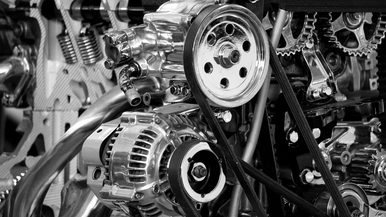 A car engine under an open hood, representing what a powertrain warranty covers