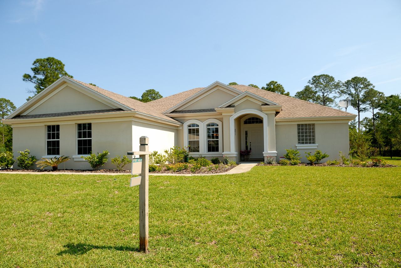 House and car keys on loan documents, representing secured loan collateral