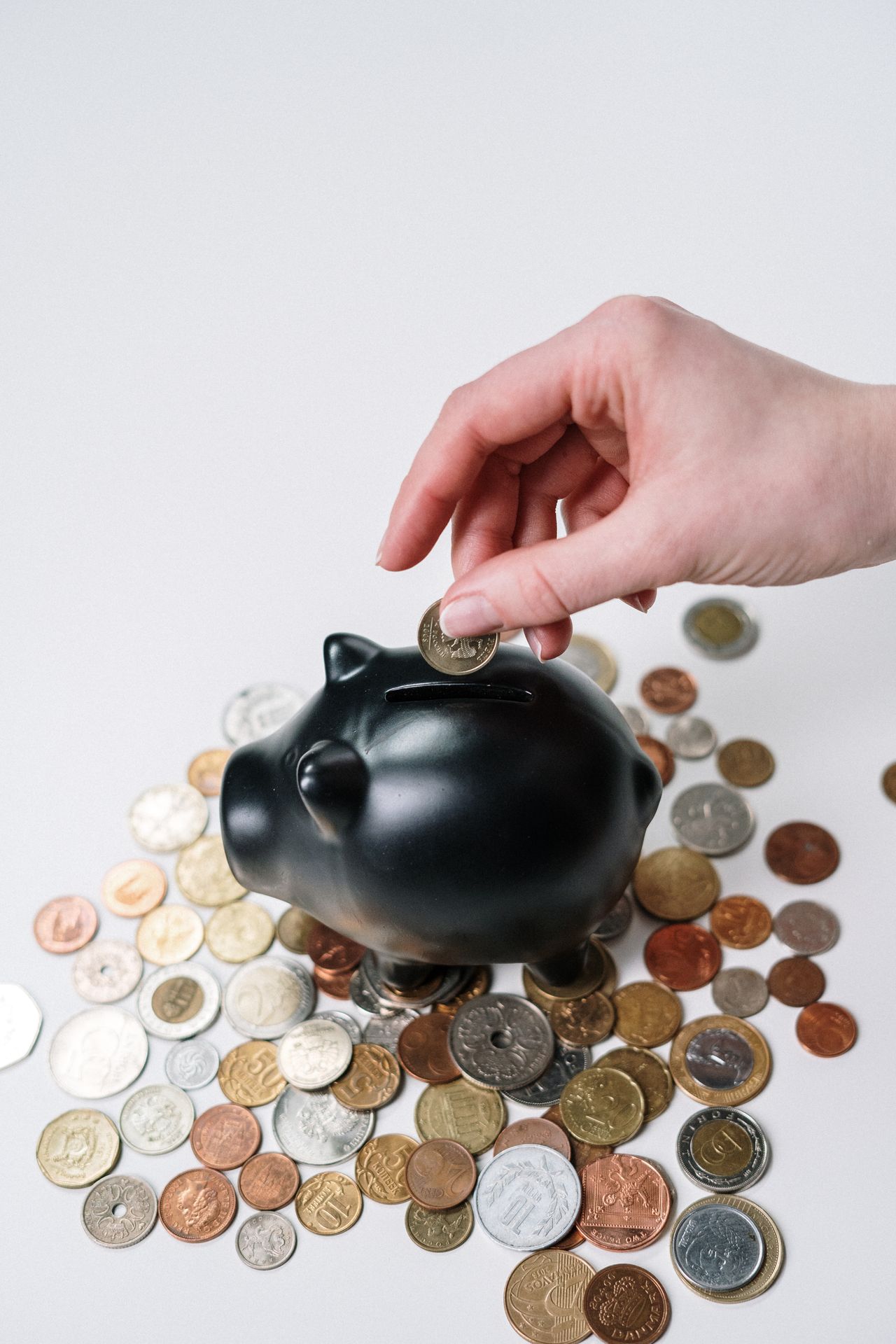 Coin added to a shrinking debt pile, one payoff method rolling into the next