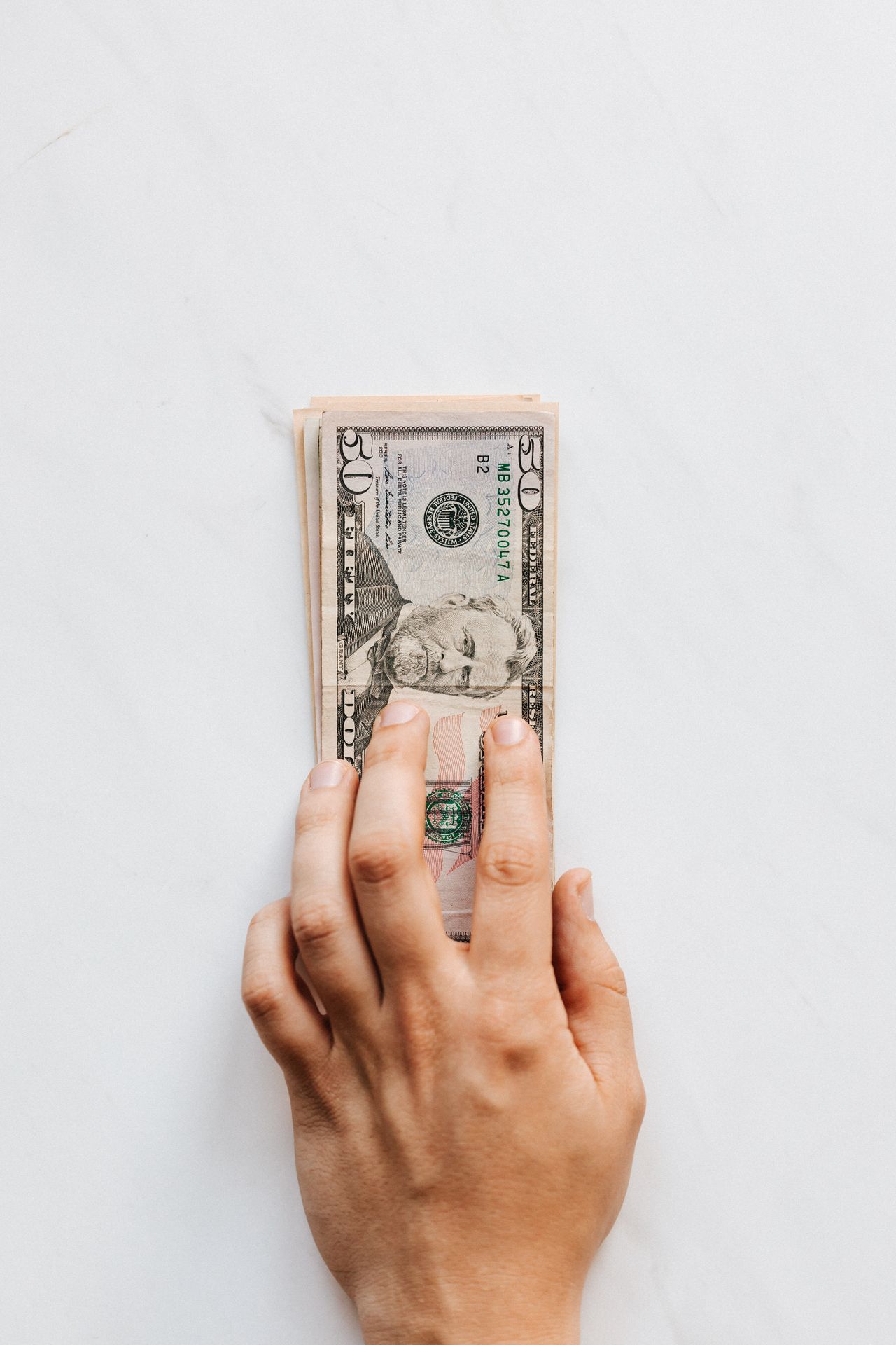 A personal loan agreement next to a credit card, representing two ways to borrow money