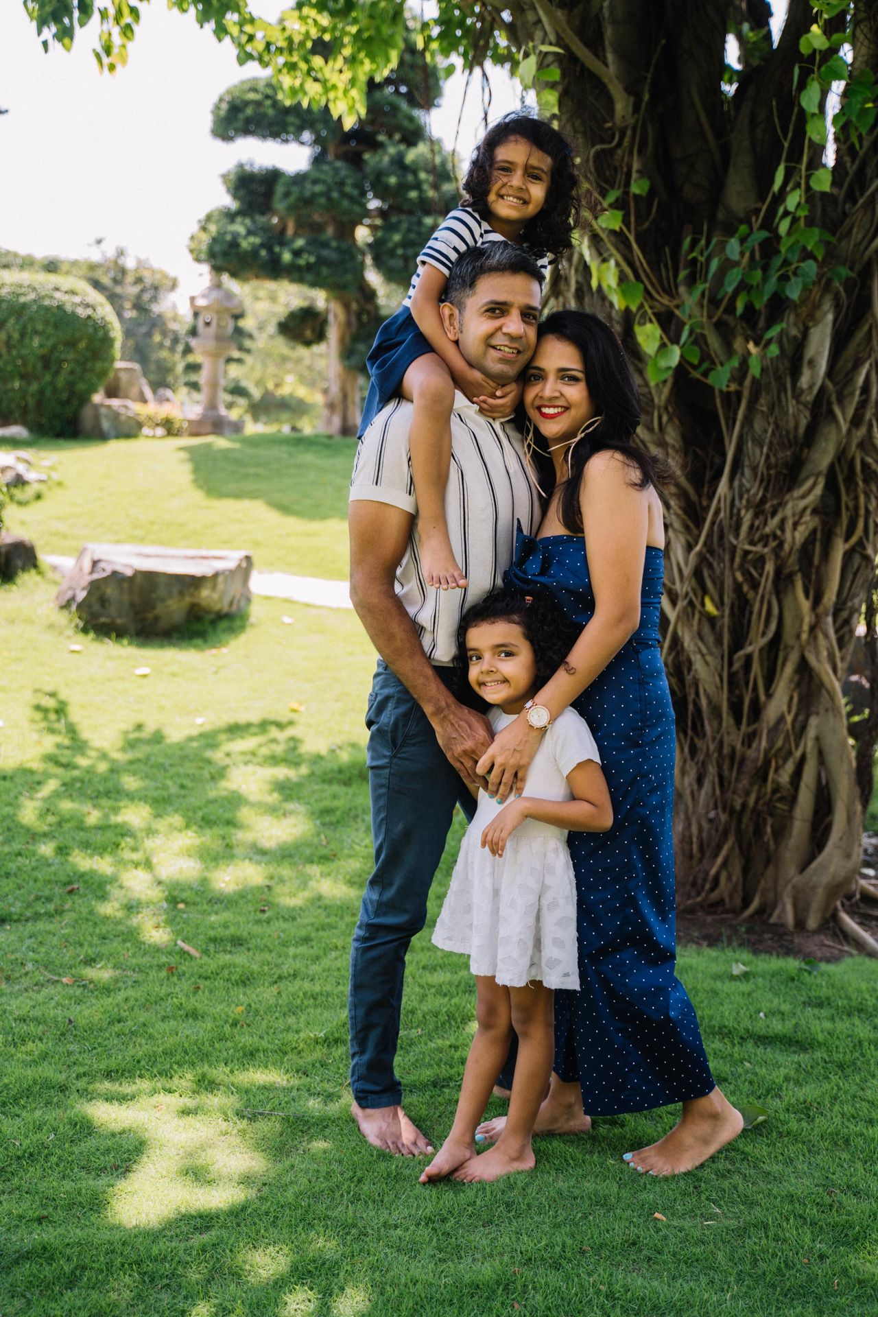 Family together in a park, the people life insurance exists to protect