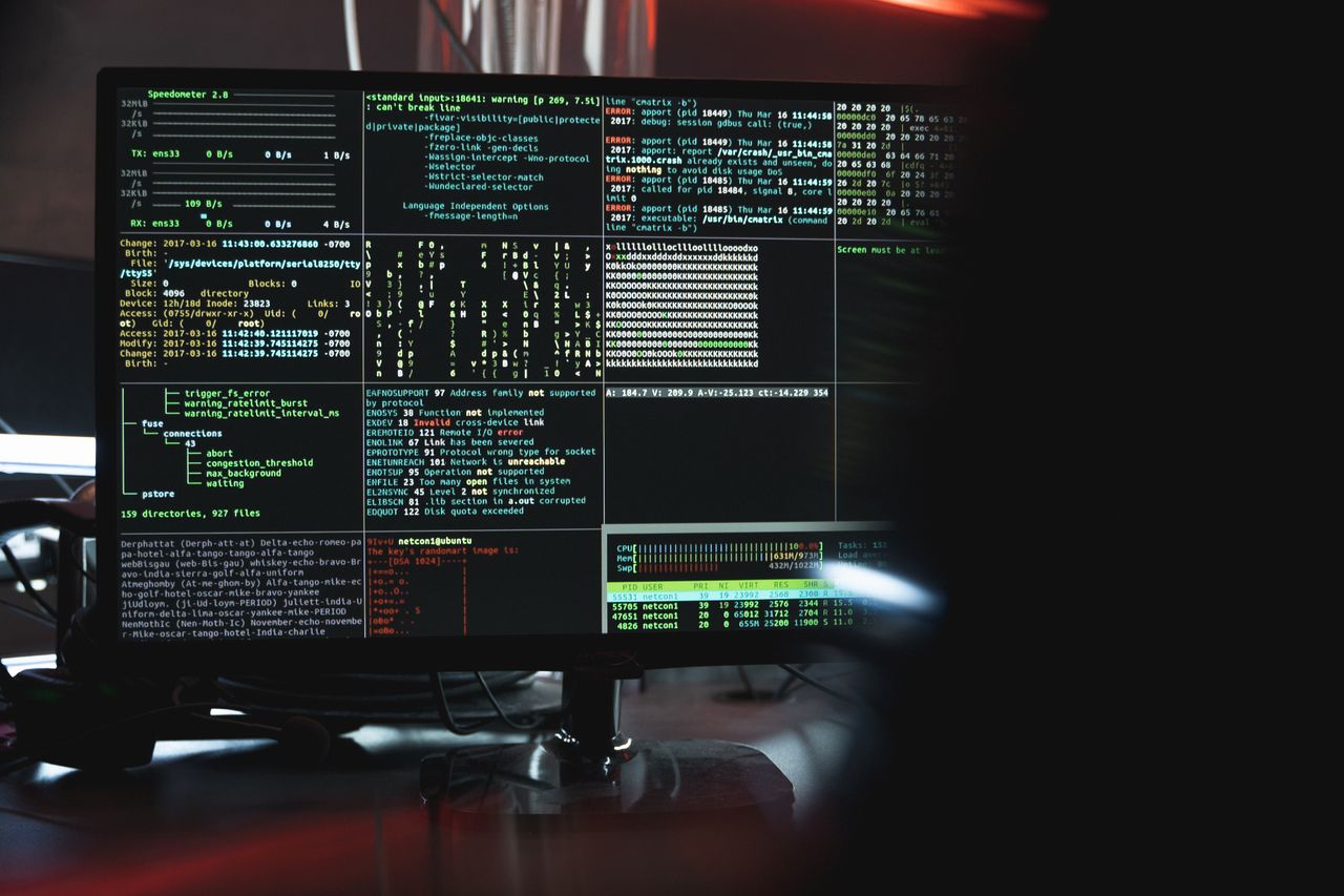 Hooded figure at a laptop, the fraud that fills the cryptocurrency space