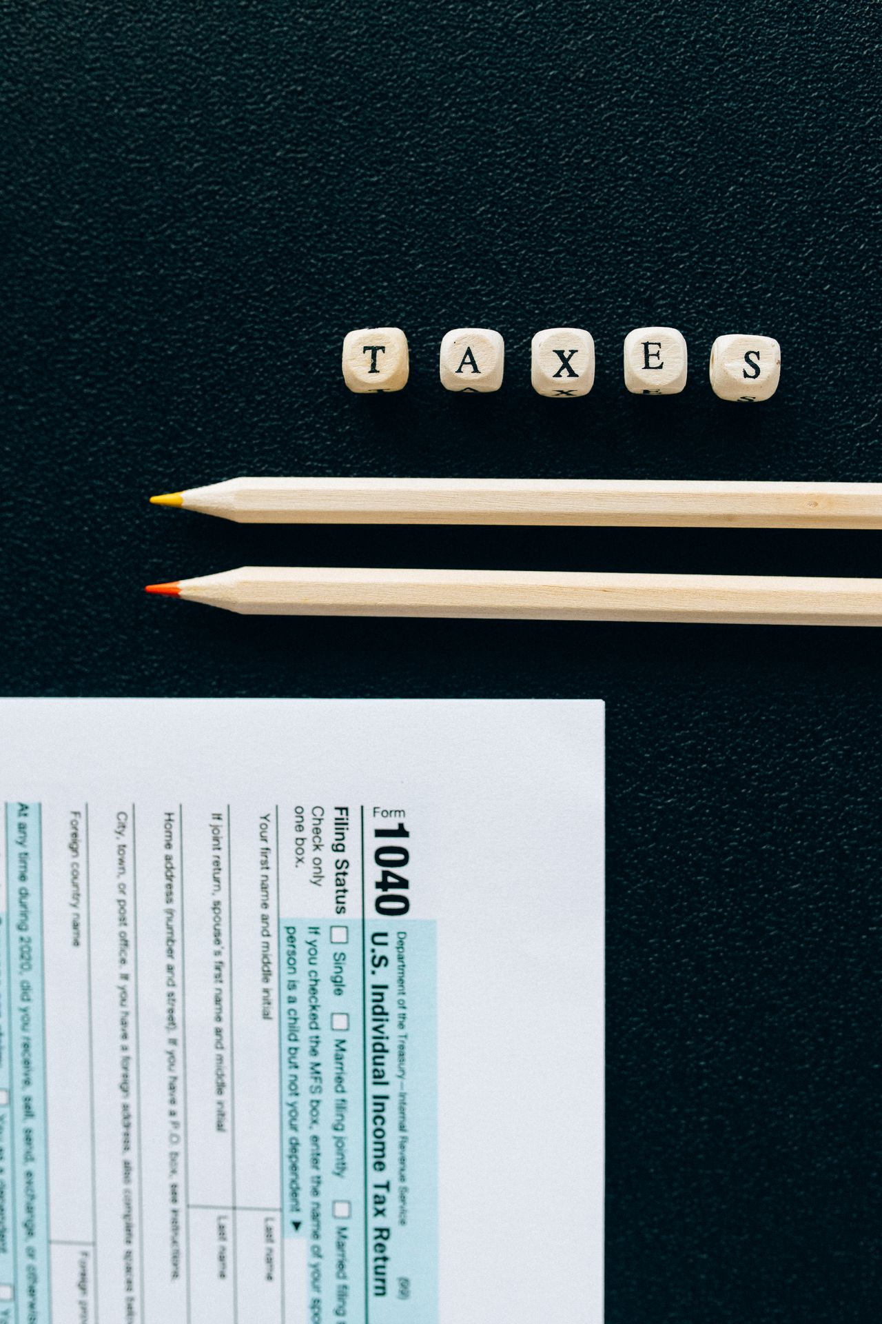 A retiree reviewing savings withdrawal figures with a calculator and notepad
