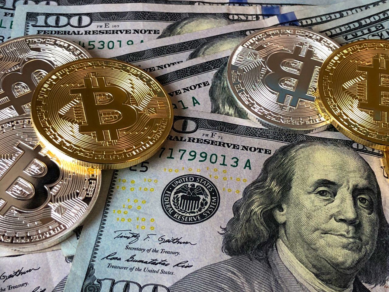 A Bitcoin coin and an Ethereum coin side by side, representing the two largest cryptocurrencies