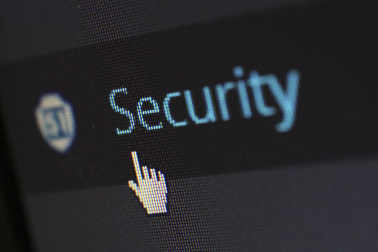 Padlock resting on a keyboard, protecting a credit file from fraud and identity theft