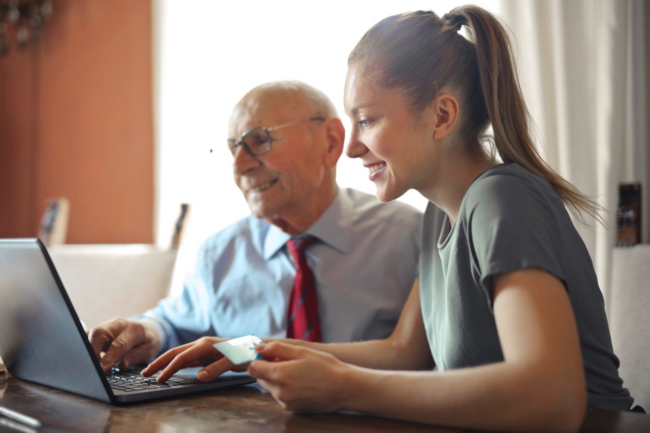 Couple reviewing finances together at a table, representing marriage and credit